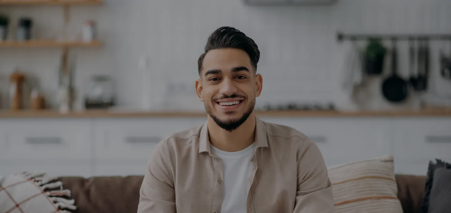Smiling patient relaxing at home after a successful procedure